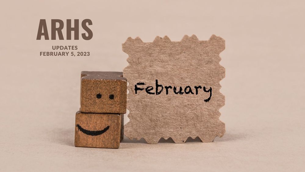 image of paper and two printing blocks representing a smiley face with text of ARHS updates, January 5, 2023