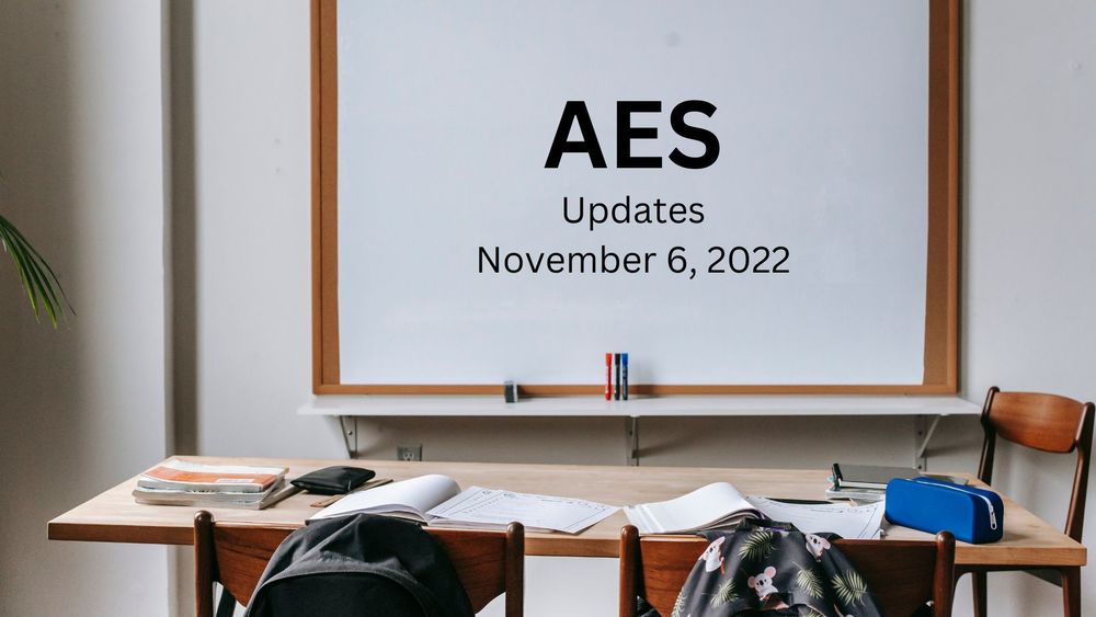 image of a classroom with text on the whiteboard of AES updates, November 6, 2022