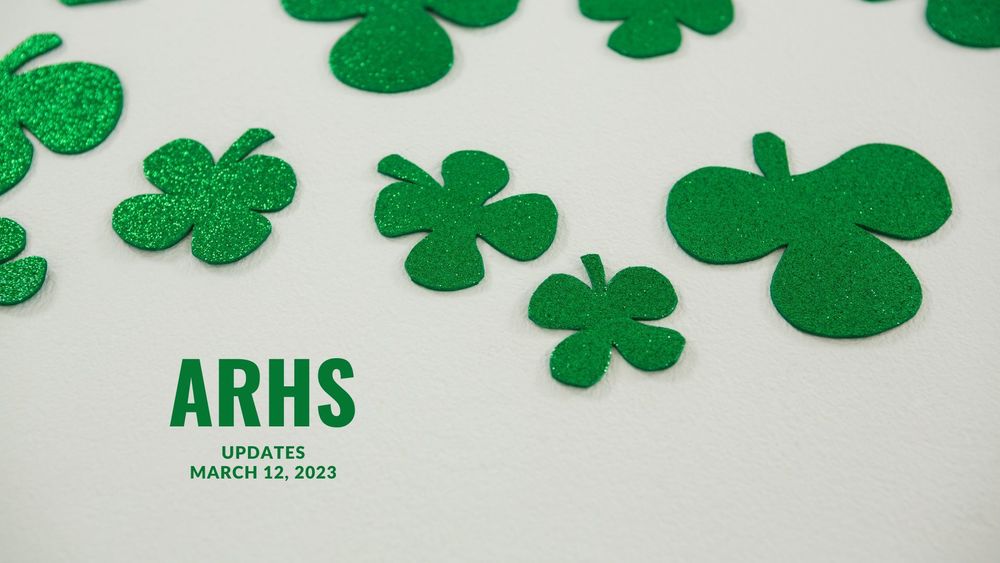 image of cut out green clovers with text of ARHS updates, March 12, 2023