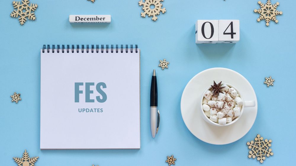 image of a notepad, pen and hot chocolate with text of FES updates, december 4