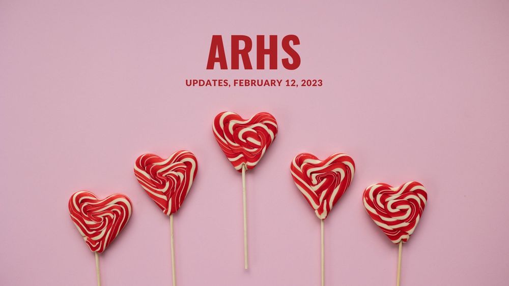 image of 5 red and white lollipops in the shape of hearts with text of ARHS Updates, February 12, 2023