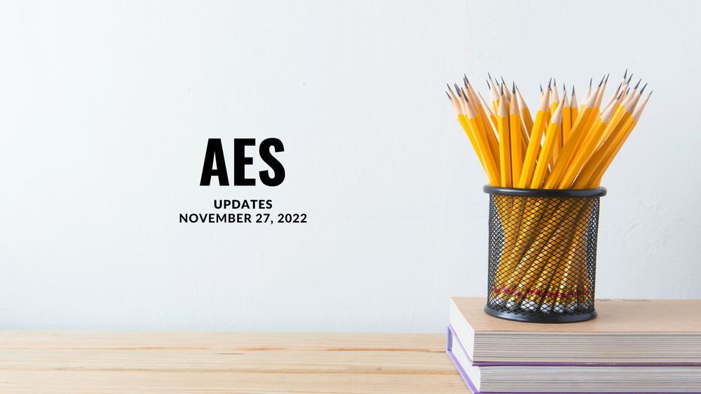image of pencils in a older on top of books with text of AES updates, November 27, 2022